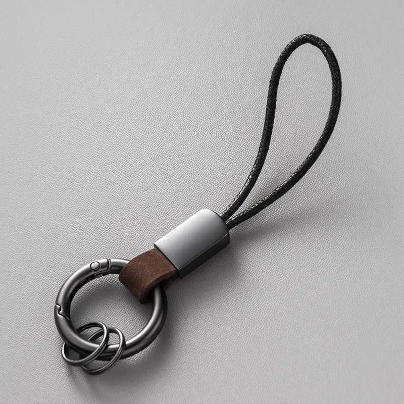 Llaveros de cuero genuino para hombres y mujeres, llavero de coche con cordón de algodón, llavero de metal, regalo, llavero moderno.