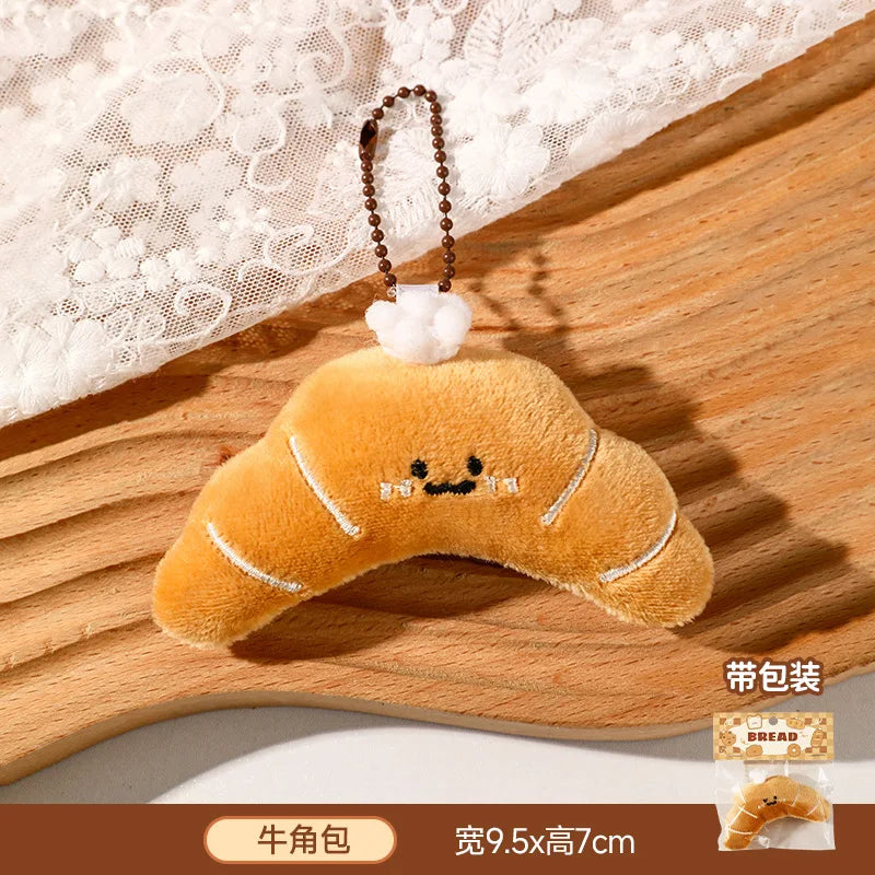 Panes lindos, bolsas de peluche, colgantes, llaveros, accesorios creativos para muñecas pequeñas, mochilas de dibujos animados para niñas al por mayor.
