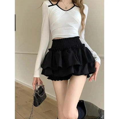 Falda negra con volantes para mujer, cintura alta, adelgazante, corte A, minimalista, estilo ballet, para verano, pantalones cortos antiexposición.